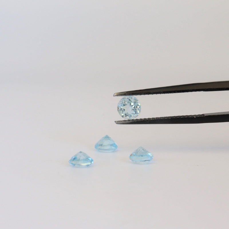 5.1mm Round Blue topaz with back view - cape diamond exchange