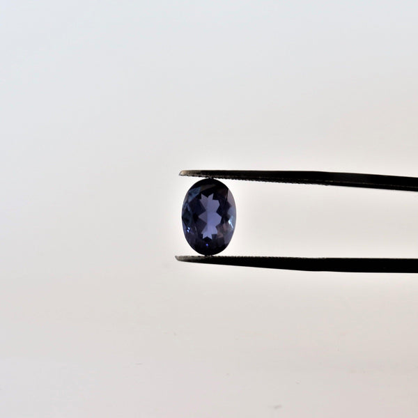 6.9mmx9.8mm Oval Iolite Stone with front view - cape diamond exchange