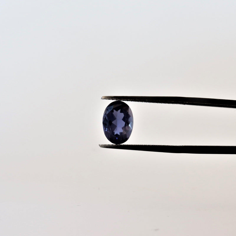 6.9mmx9.8mm Oval Iolite Stone with front view - cape diamond exchange