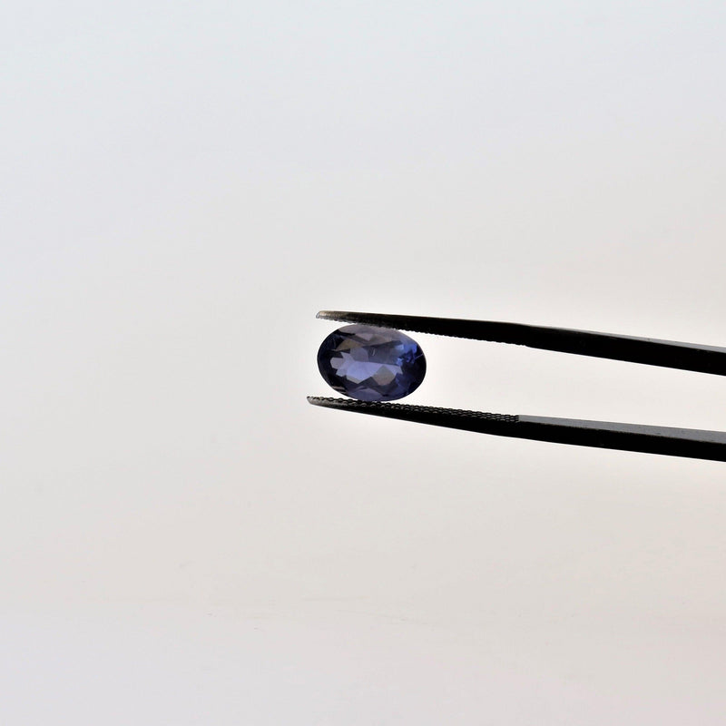 6.9mmx9.8mm Oval Iolite Stone with side view - cape diamond exchange
