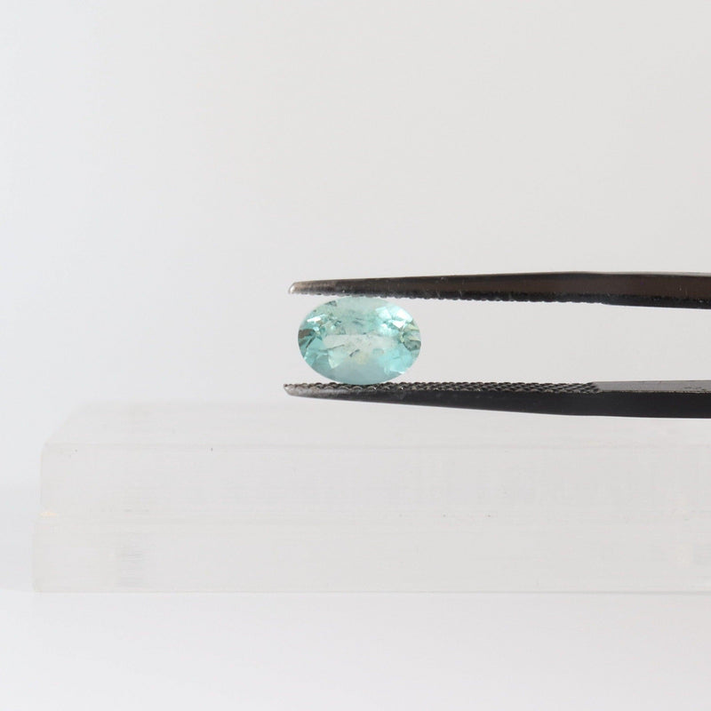 7.4mm x 5.4mm Oval Aquamarine Stone with tweezer - cape diamond exchange
