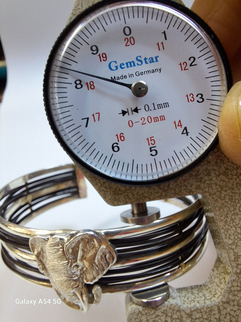 Silver Elephant hair multi-stranded bangle with one large head open bangle-Cape Diamond Exchange.
