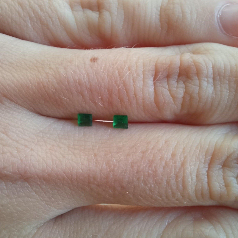 0.08ct Princess Cut Emerald Stone with finger view - cape diamond exchange