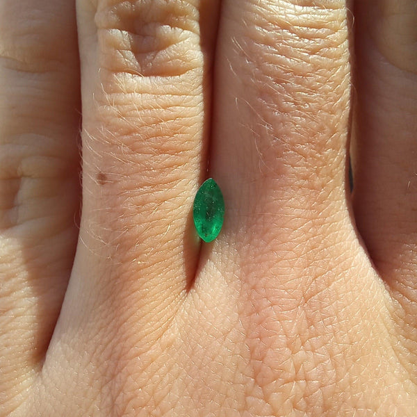 0.41ct Marquise Emerald Stone with finger view - cape diamond exchange