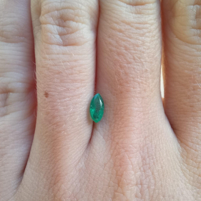 0.41ct Marquise Emerald Stone light finger view - cape diamond exchange