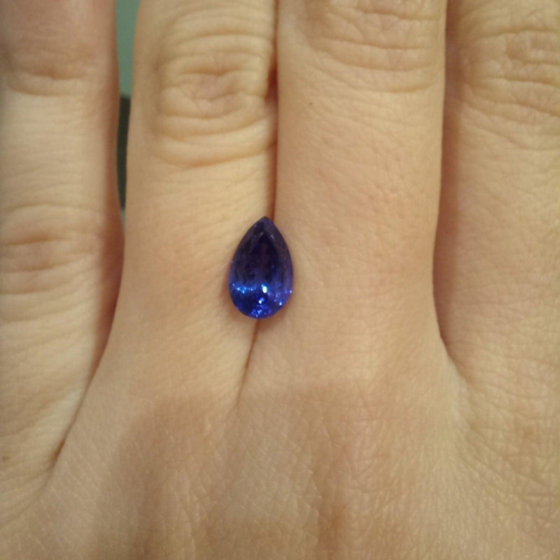 1.48ct Pear Tanzanite Stone with finger view - cape diamond exchange