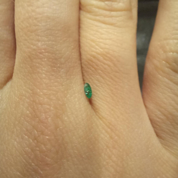 1.7x3.6mm Marquise Emerald Stone with finger view - cape diamond exchange