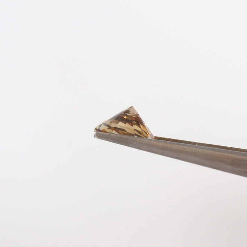 10mm x10mm Octagon Citrine Stone bottom view with tweezers - cape diamond exchange