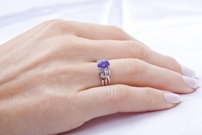 Oval Tanzanite Gold Ring decorated with Baguettes - Cape Diamond Exchange