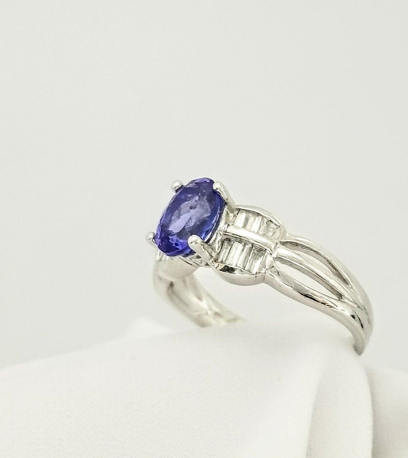 Oval Tanzanite Gold Ring decorated with Baguettes - Cape Diamond Exchange