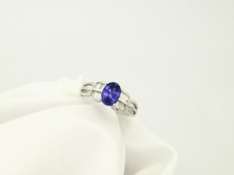 Oval Tanzanite Gold Ring decorated with Baguettes - Cape Diamond Exchange