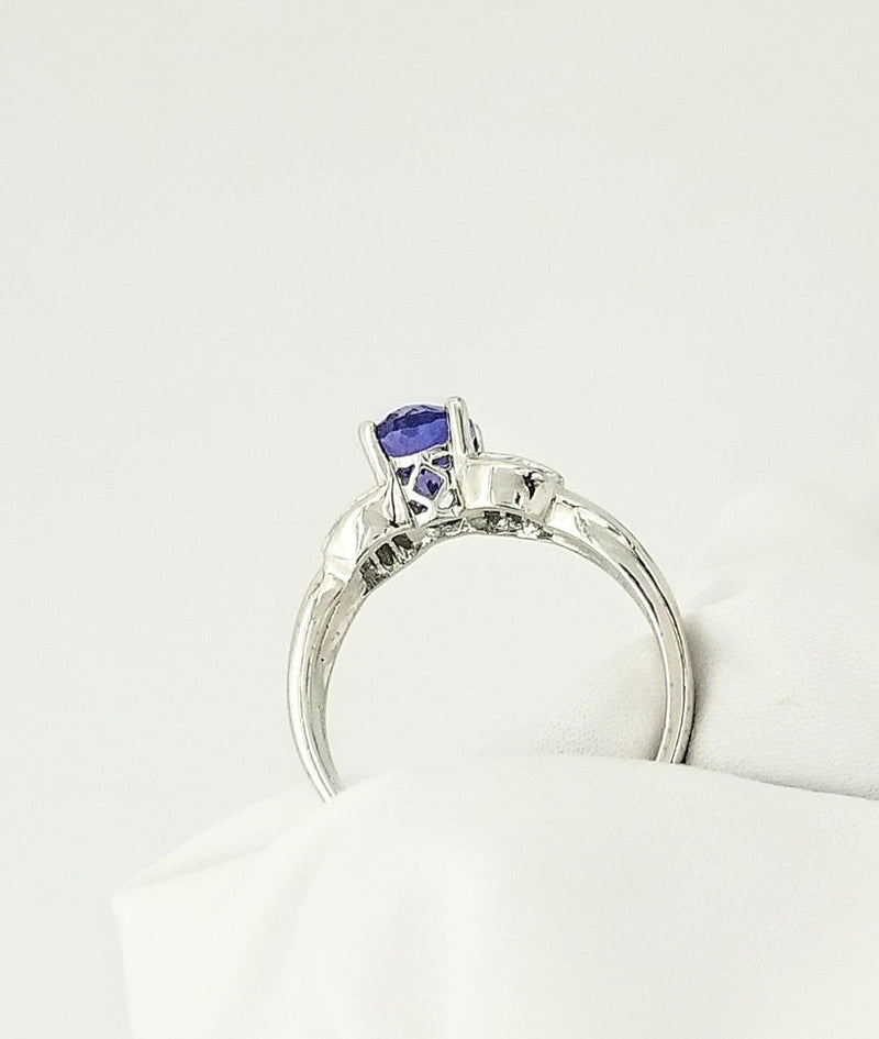 Oval Tanzanite Gold Ring decorated with Baguettes - Cape Diamond Exchange