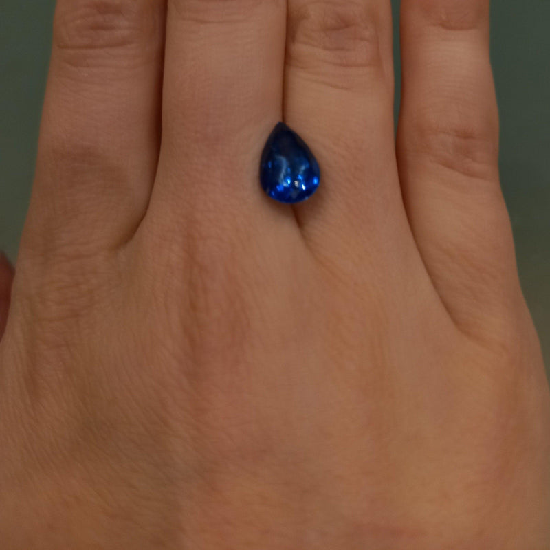 3.04ct Pear Tanzanite Stone with finger view - cape diamond exchange