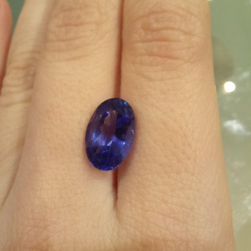 3.94ct Oval Tanzanite Stone with finger view - cape diamond exchange