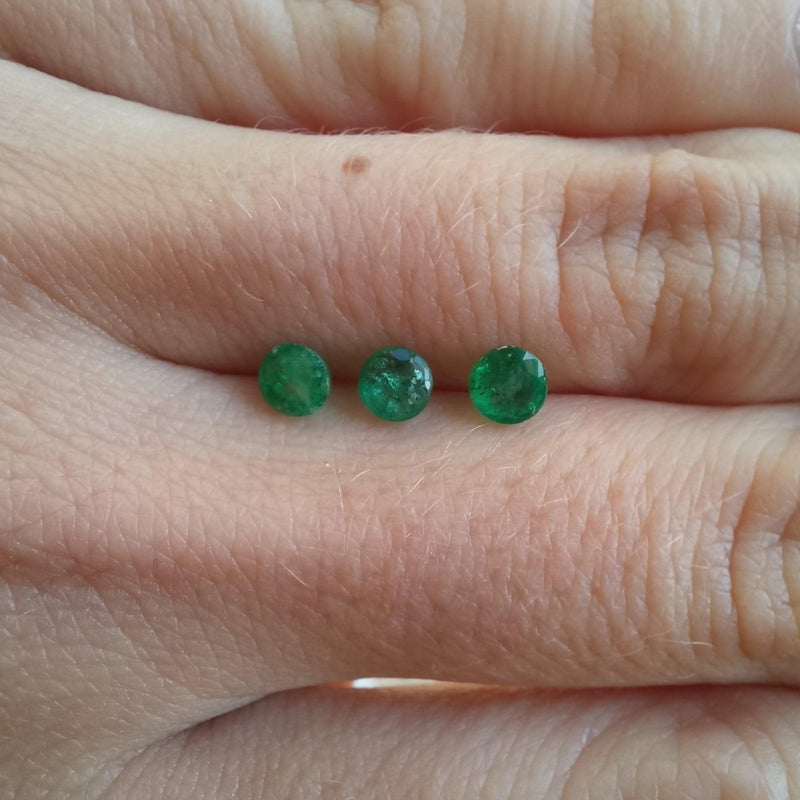 3.9mm Round Emerald Stone with finger view - cape diamond exchange