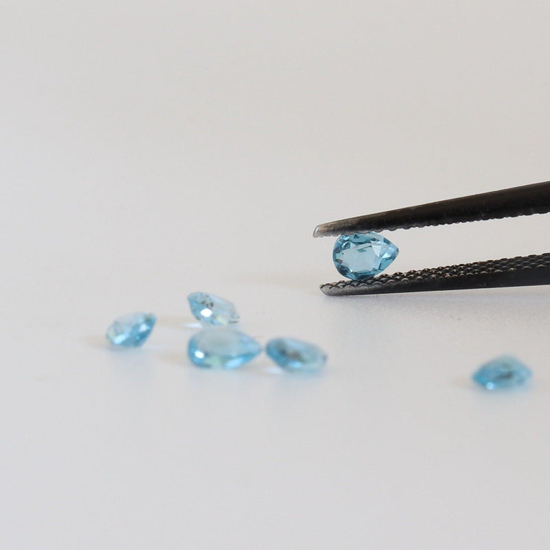 4mmx3mm Sky Blue Topaz Pear Shape Stone with side view - cape diamond exchange