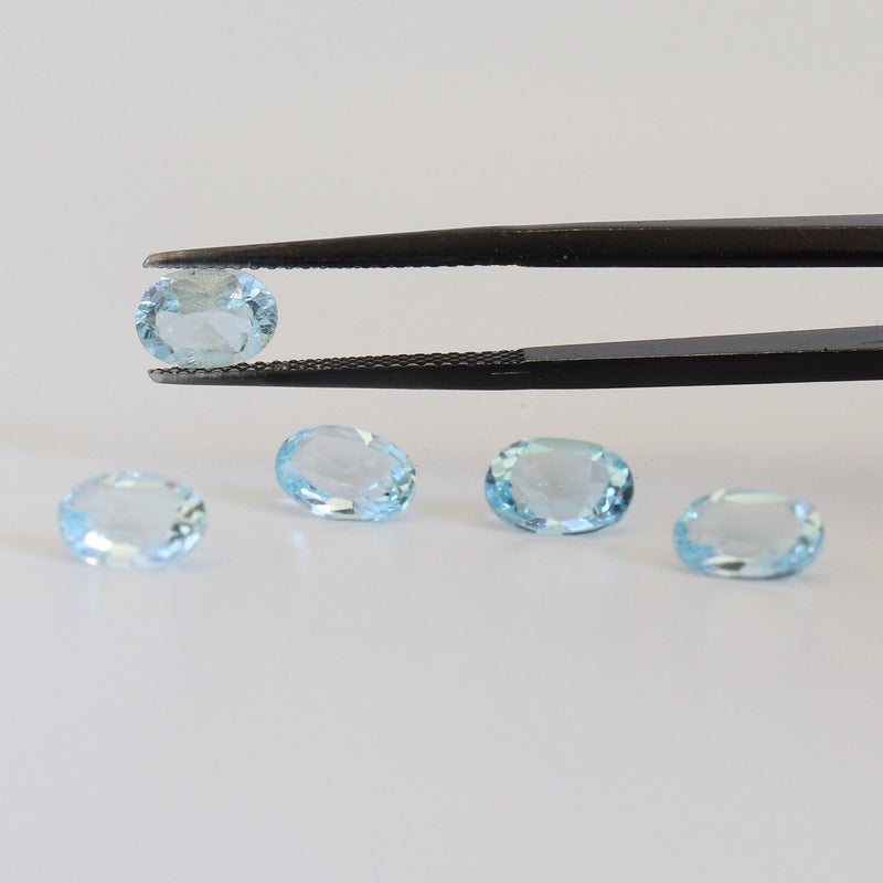 5mmx7mm Sky Blue Oval Topaz Stone with side view - cape diamond exchange
