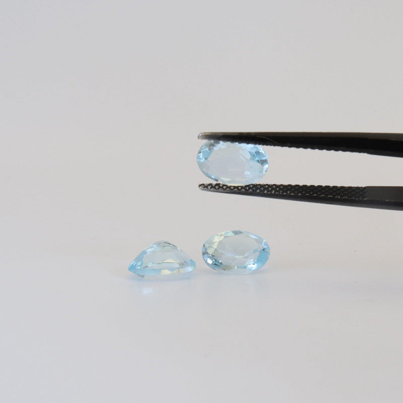 8.1mmx6.1mm Sky Blue Oval Topaz Stone with top and bottom view - cape diamond exchange