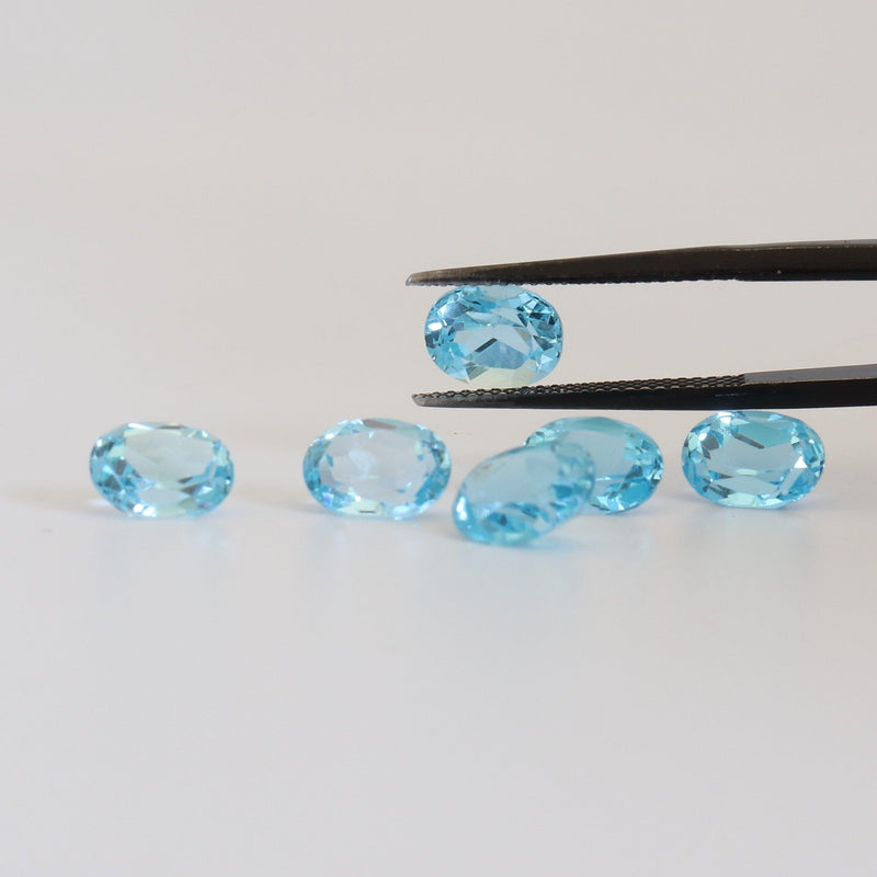 8mmx6mm Swiss Blue Oval Topaz with a view - cape diamond exchange