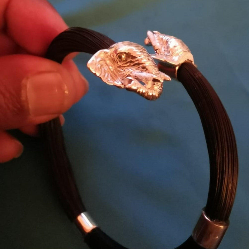 Elephant hair pony-tail bypass bangle with elephant head ending or leopard head ending. Your choice. The ending are in a bypass design and this makes the bangle suitable for different wrist sizes. Cape Diamond Exchange