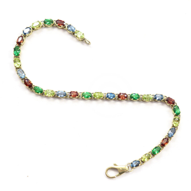 Multicolored Bracelet set with Peridot, Garnet and Topaz in Yellow Gold