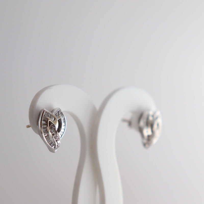 18kt White Gold  Heart shaped baguette diamond earrings	side view - cape diamond exchange				