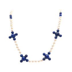 This masterpiece is a glass bead with a pearl coating and a polished lapis lazuli necklace.  The wearer of this special piece knows the significance of the lapis lazuli stone, it's been used for centuries for protection.  Lapis Lazuli is one of the oldest spiritual stones known to man.  Cape Diamond exchange 
