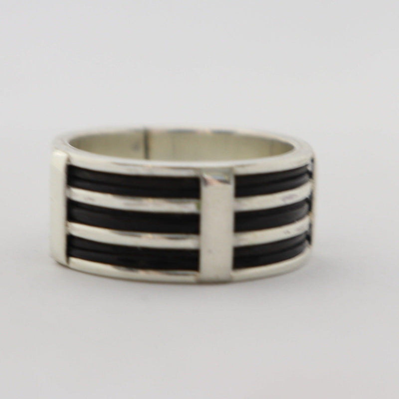 Silver ring with 6 rows of elephant hair. This unique unisex ring has 2 x 3 strands of elephant hair separated by a gleaming band of silver between each pair of strands creating a very unique look.   The elephant hair ring symbolizes good luck,  wearing a ring like this will keep a spring in your step knowing luck is always on your side.     The ring is adjustable, it's best to know your ring size ahead of ordering.  Cape  diamond exchange 