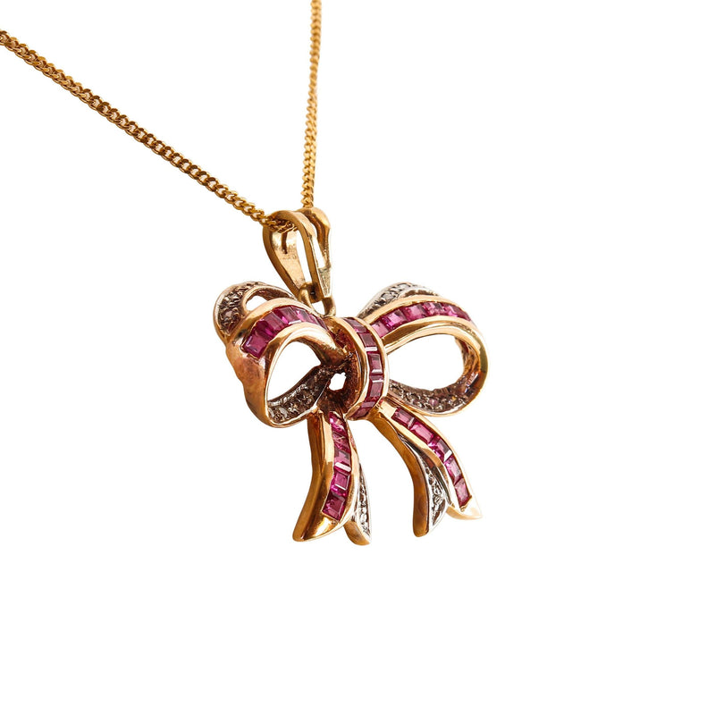 Diamond and Ruby Bow Pendant set in 9 kt Yellow Gold