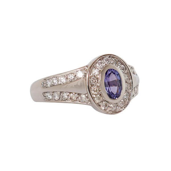 18 kt White Gold Split Band Ring with Oval Tanzanite and Channel-set Diamonds - Cape Diamond Exchange