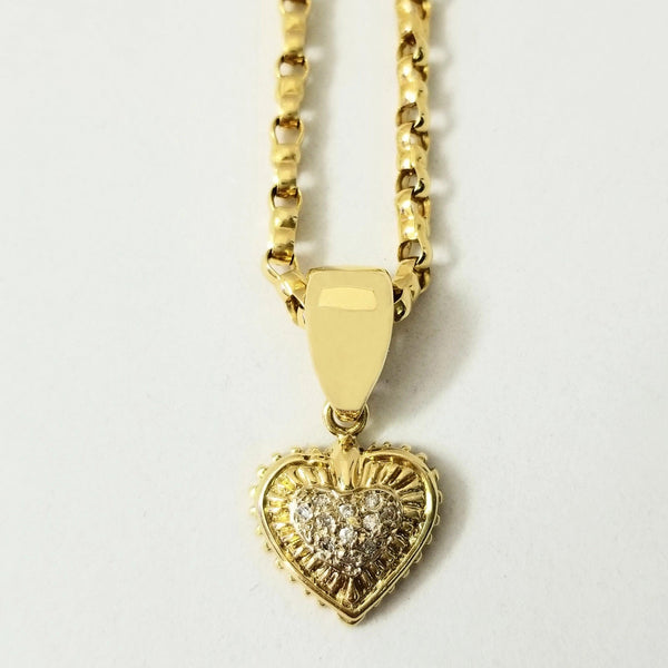 18kt Yellow Gold Heart with diamonds totaling 0.11 carat. A heart of gold, that's what you have! Keep the light alive with this vivacious Heart that has diamonds nestled at the core surrounded by gleaming gold. Cape Diamond Exchange 